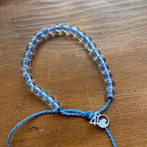 4 oceans clear beaded blue string bracelet
